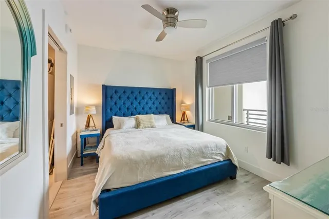 a bed sitting in a bedroom next to a window