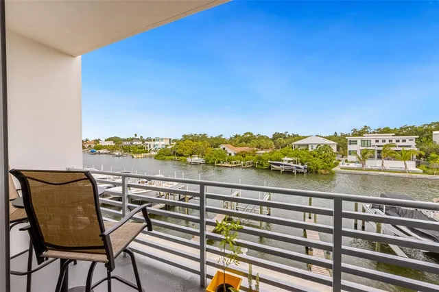 a view of a balcony with chair and table