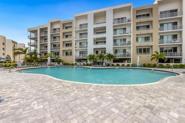 a view of building with yard in front of it