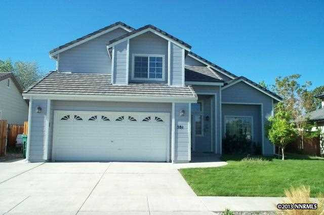 581 Putnam Drive Reno, NV 89503 - Photo 1 of 1 a front view of a house with a garden and yard