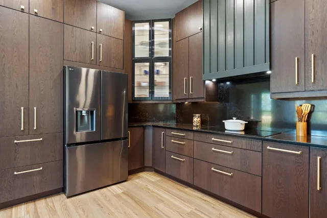 a kitchen with granite countertop cabinets and window