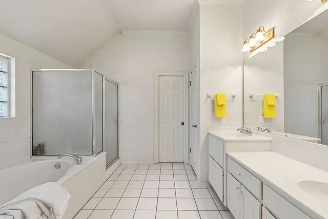 a bathroom with a bathtub and a shower