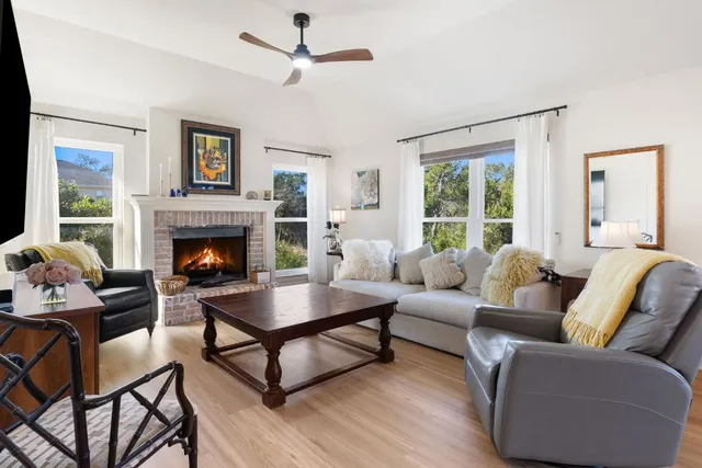 a spacious bathroom with a tub sink and mirror