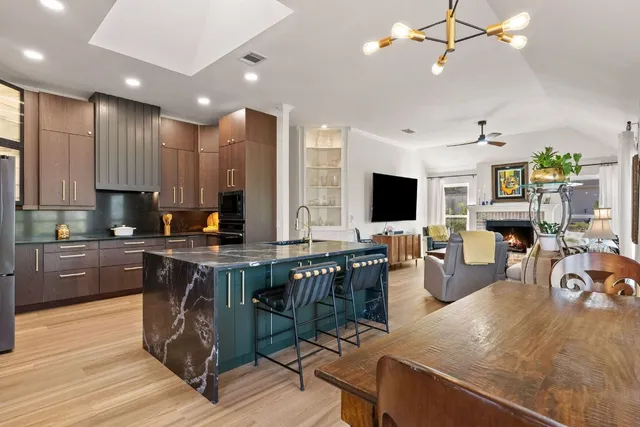 a living room with furniture potted plant and a window