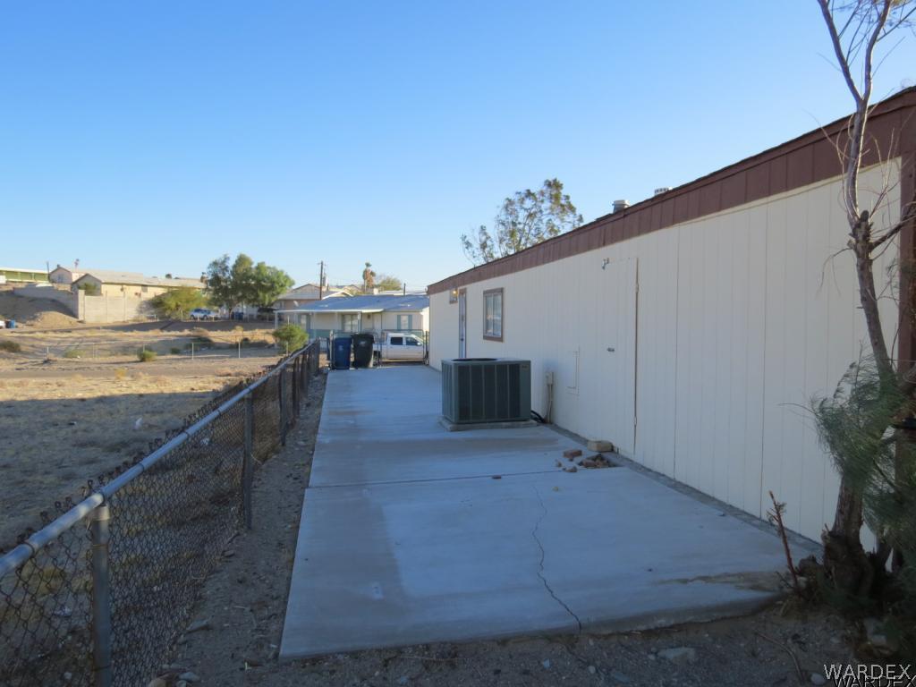 1688 Toro Road Bullhead City, AZ 86442 - Photo 31 of 32 Right side of home RV parking