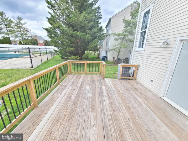a view of balcony with deck and wooden floor