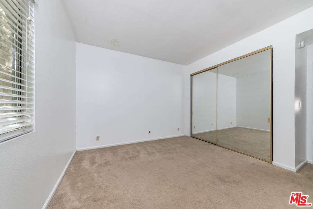 5139 Balboa Boulevard, Unit 9 Encino, CA 91316 - Photo 15 of 30 an empty room with windows and closet