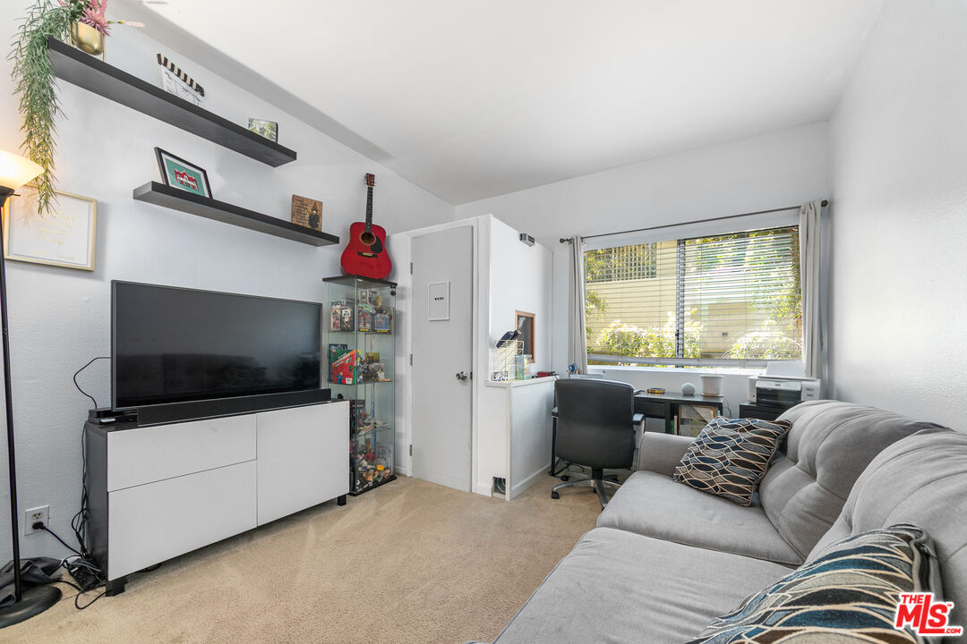 5139 Balboa Boulevard, Unit 9 Encino, CA 91316 - Photo 17 of 30 a living room with furniture and a flat screen tv