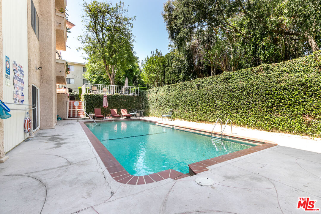 5139 Balboa Boulevard, Unit 9 Encino, CA 91316 - Photo 28 of 30 a view of a swimming pool with a yard