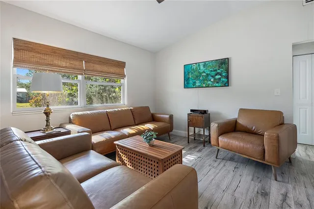 a living room with furniture and a window