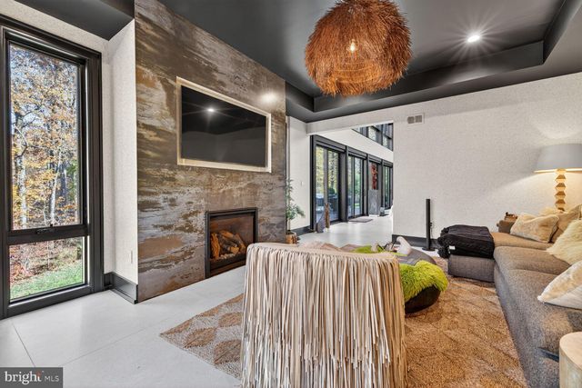 a bedroom with a bed window and a fireplace