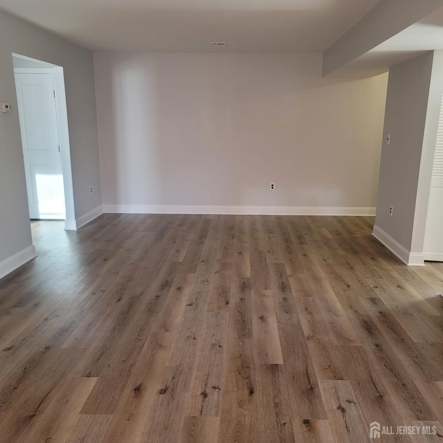 1617 Raspberry Court Edison, NJ 08817 - Photo 10 of 15 an empty room with wooden floor