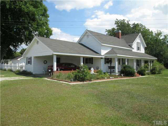 338 Guy Road Angier, NC 27501 - Photo 1 of 13 a front view of a house with a yard and garage