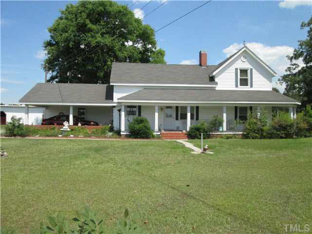 338 Guy Road Angier, NC 27501 - Photo 2 of 13 a front view of a house with a yard and porch