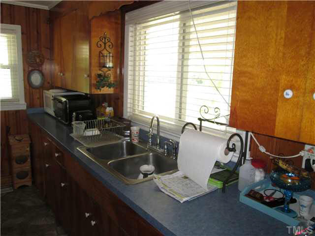 338 Guy Road Angier, NC 27501 - Photo 11 of 13 a bathroom with a double vanity sink and a mirror