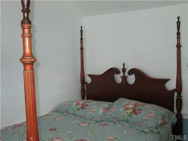 338 Guy Road Angier, NC 27501 - Photo 12 of 13 a bedroom with a bed and a window