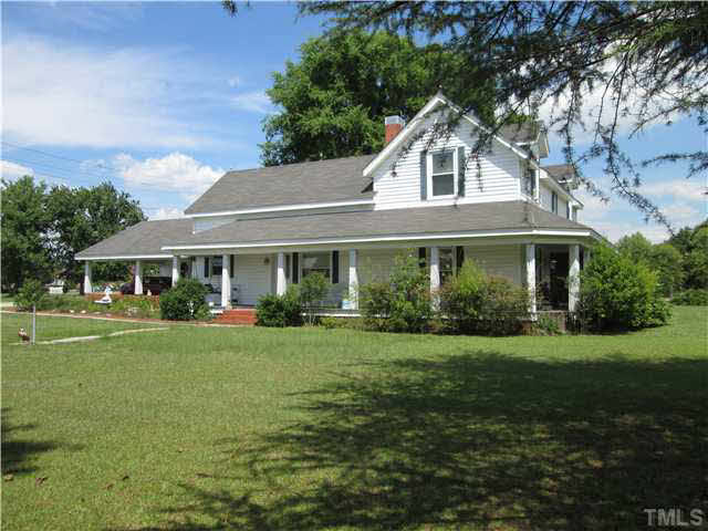 338 Guy Road Angier, NC 27501 - Photo 3 of 13 a front view of a house with a garden
