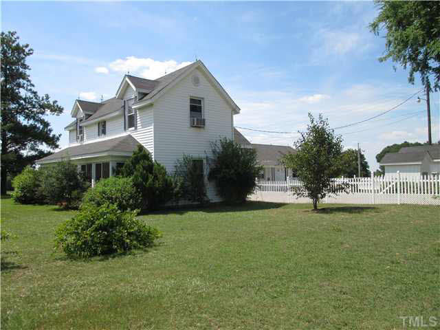 338 Guy Road Angier, NC 27501 - Photo 4 of 13 a front view of a house with a garden