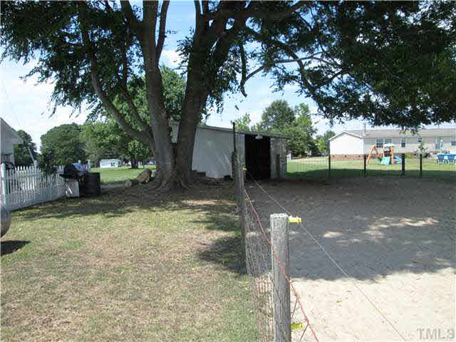 338 Guy Road Angier, NC 27501 - Photo 6 of 13 a view of a yard with a tree