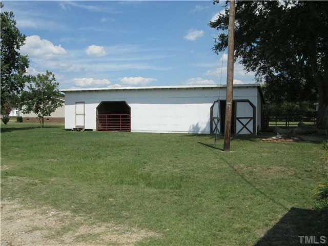 338 Guy Road Angier, NC 27501 - Photo 7 of 13 a house view with a garden space