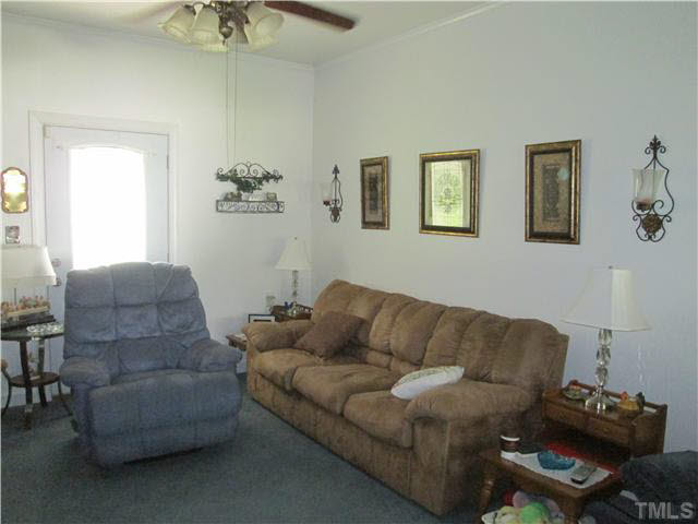 338 Guy Road Angier, NC 27501 - Photo 8 of 13 a living room with furniture and a couch
