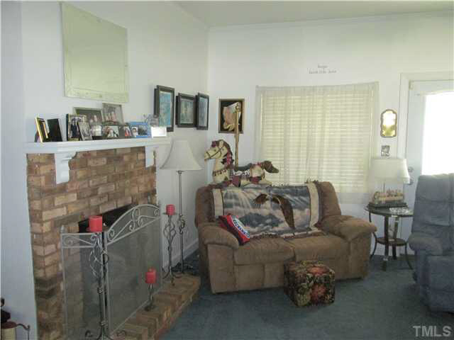 338 Guy Road Angier, NC 27501 - Photo 9 of 13 a living room with furniture and a wooden floor
