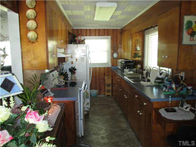 338 Guy Road Angier, NC 27501 - Photo 10 of 13 a kitchen with sink and refrigerator