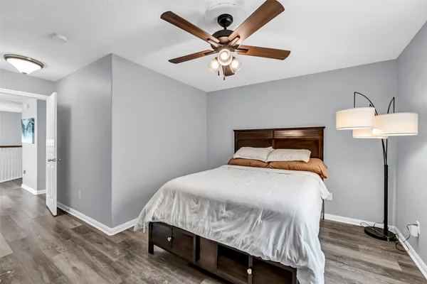 a bedroom with a bed and a table