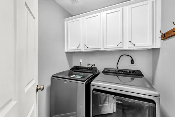 a view of storage and utility room with washer and dryer