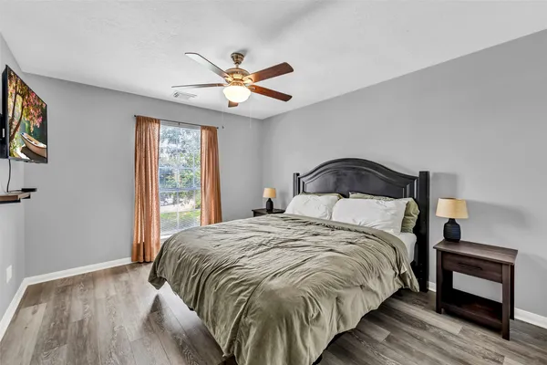 a bedroom with a bed and a window