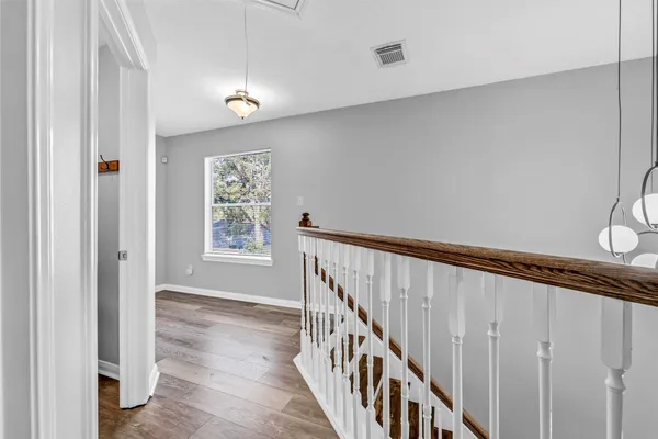 a view of entryway with wooden floor