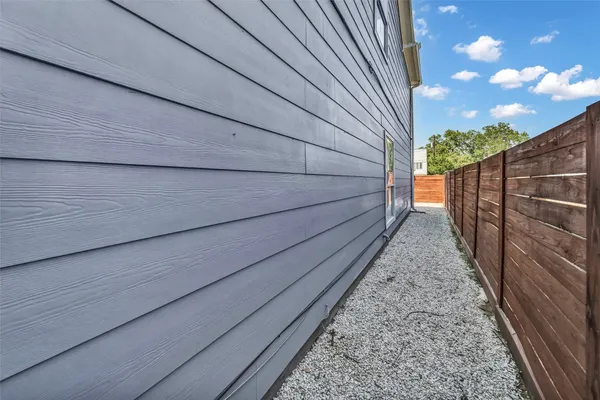 a view of house with wooden fence