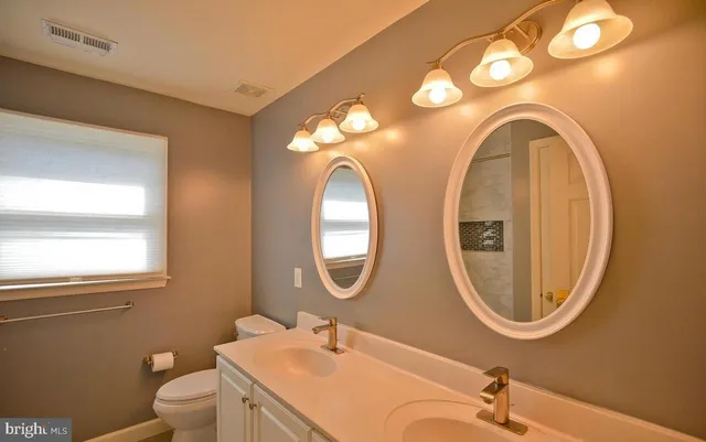 a view of a kitchen with a refrigerator and a table