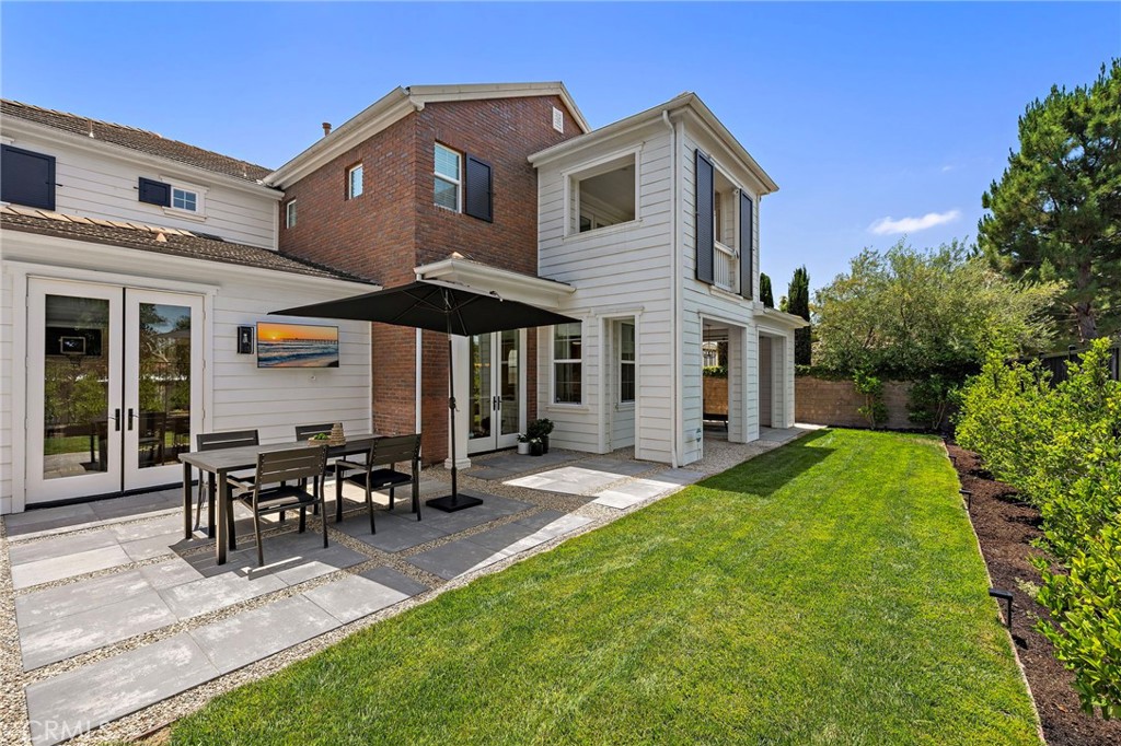 3 Tranquility Place Ladera Ranch, CA 92694 - Photo 39 of 63 a patio with table and chairs and potted plants