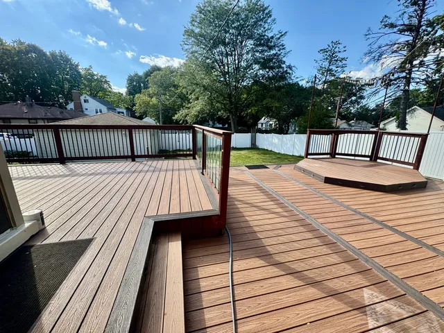 a view of a house with a yard porch and sitting area
