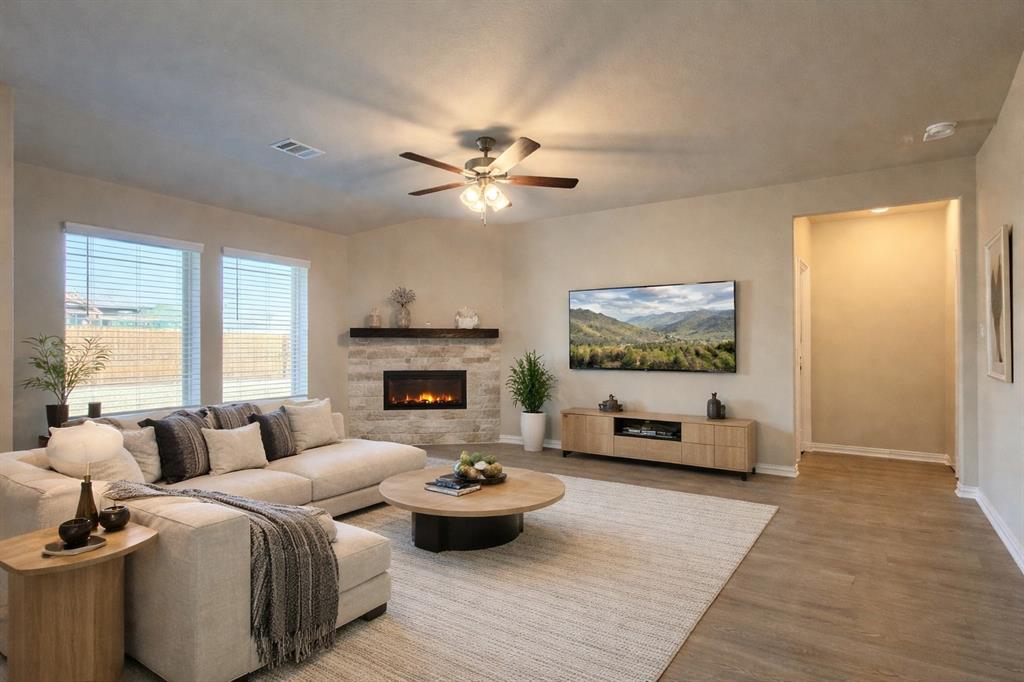 5401 Inwood Drive Denton, TX 76207 - Photo 2 of 21 a living room with furniture and a fireplace