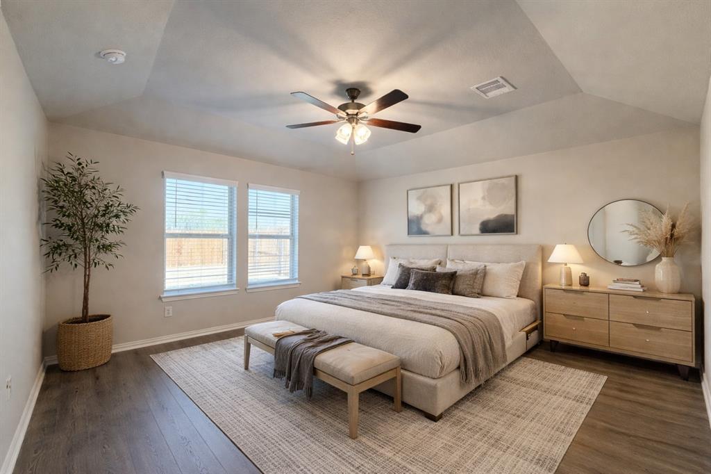 5401 Inwood Drive Denton, TX 76207 - Photo 3 of 21 a bedroom with a bed and a chandelier
