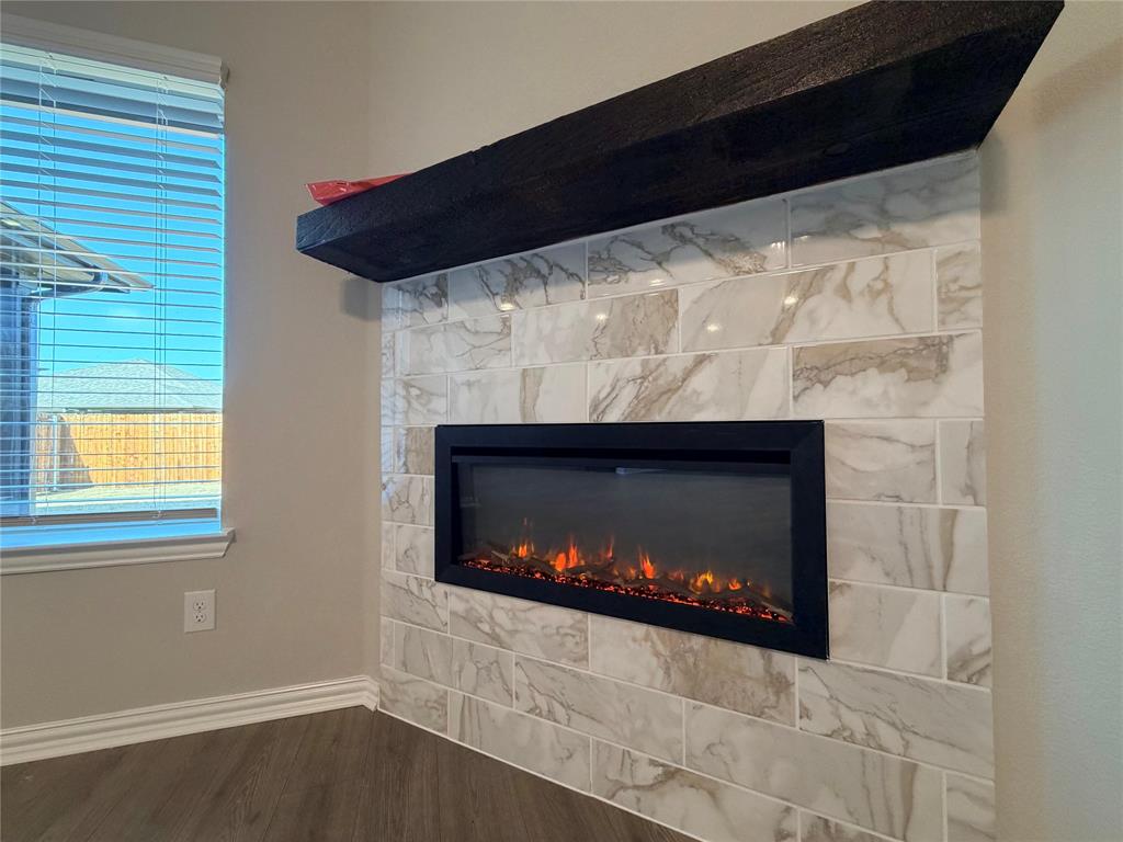 5401 Inwood Drive Denton, TX 76207 - Photo 6 of 21 a room with fireplace and a fireplace