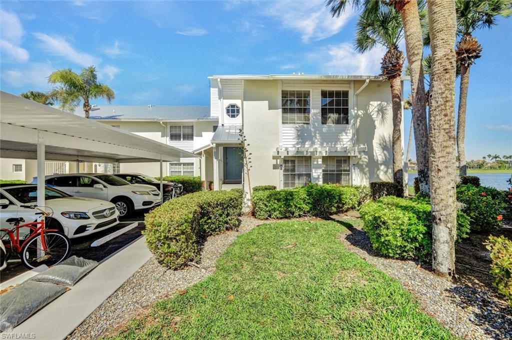 14985 Rivers Edge Court, Unit 236 Fort Myers, FL 33908 - Photo 3 of 33 a front view of a house with garden