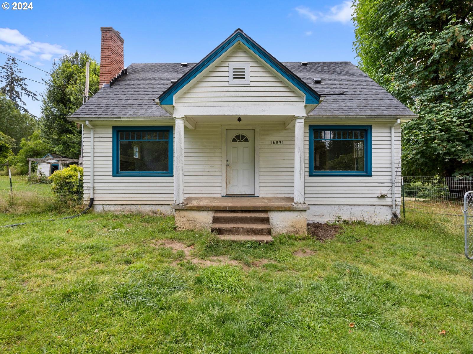 16091 Southeast Royer Road Damascus, OR 97089 - Photo 1 of 41 a front view of a house with garden