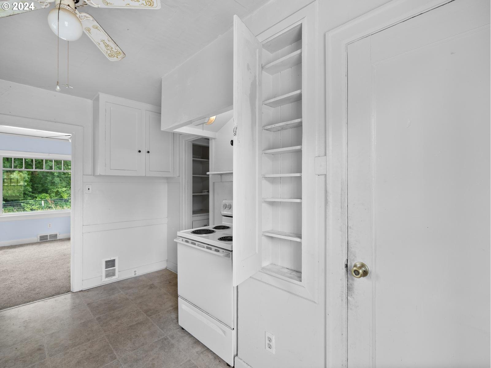 16091 Southeast Royer Road Damascus, OR 97089 - Photo 12 of 41 a view of cabinets with wooden floor