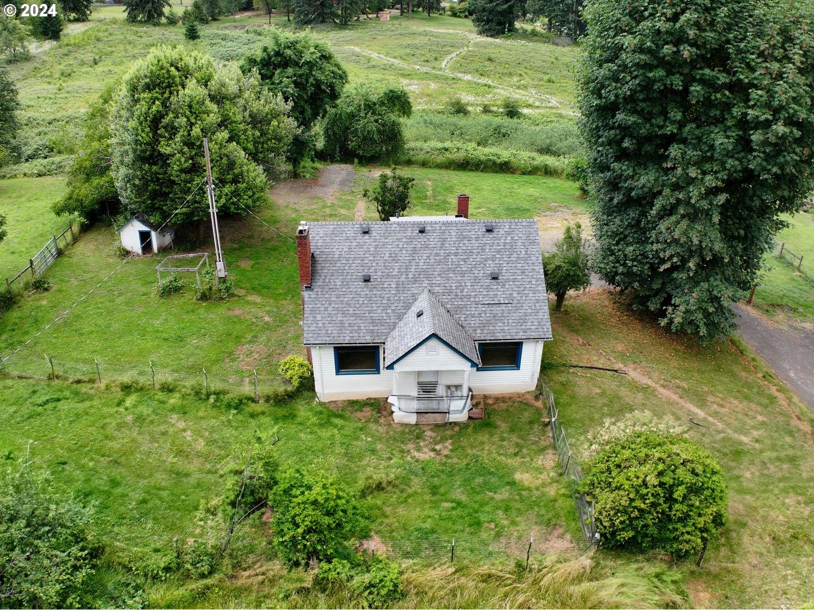 16091 Southeast Royer Road Damascus, OR 97089 - Photo 3 of 41 an aerial view of a house with swimming pool garden and patio
