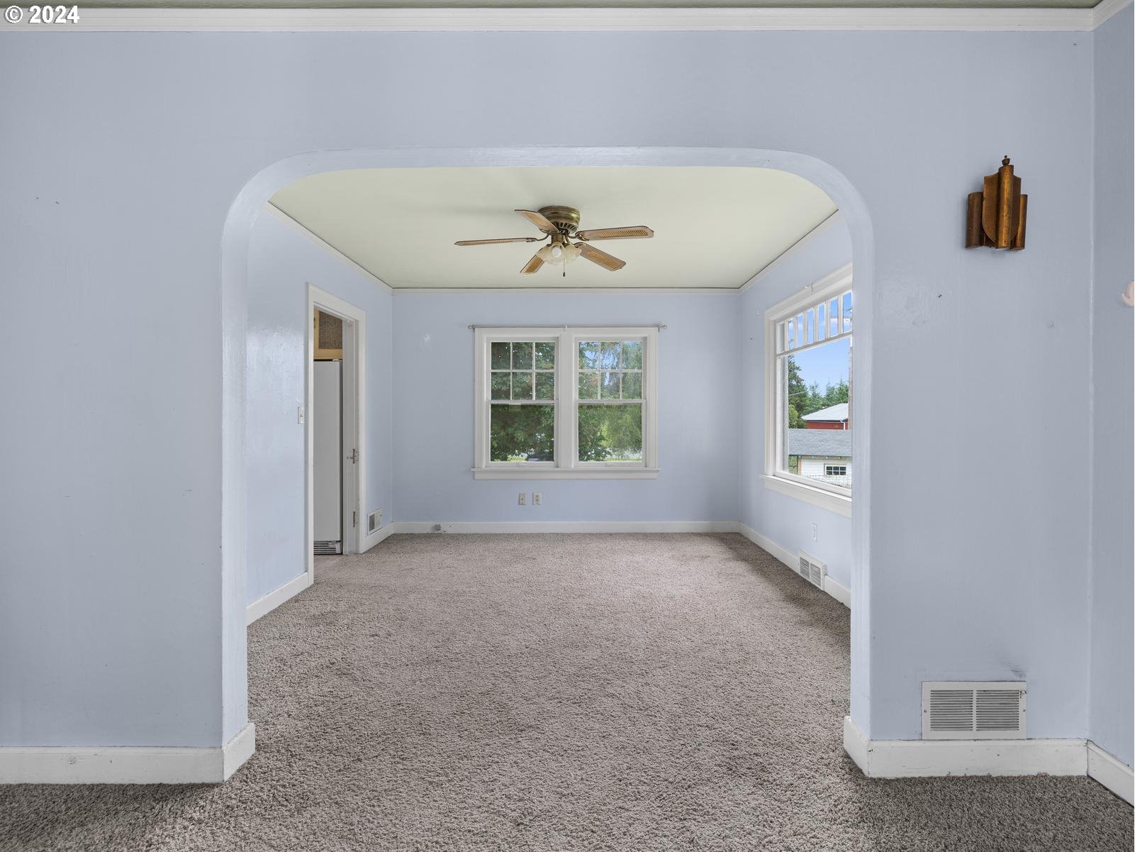 16091 Southeast Royer Road Damascus, OR 97089 - Photo 6 of 41 an empty room with windows and ceiling fan