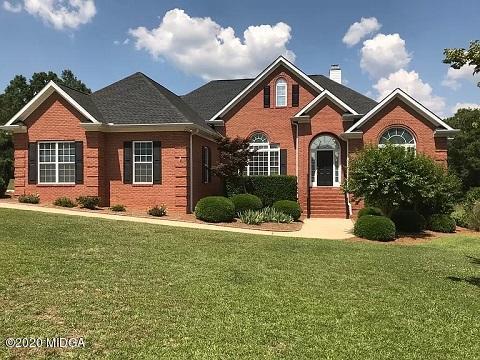 9743 Lower Thomaston Road Macon, GA 31220 - Photo 1 of 28 a front view of a house with yard and green space