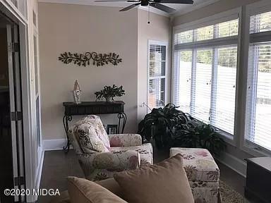 9743 Lower Thomaston Road Macon, GA 31220 - Photo 11 of 28 a living room with furniture and a large window