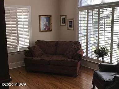 9743 Lower Thomaston Road Macon, GA 31220 - Photo 13 of 28 a living room with furniture and a large window