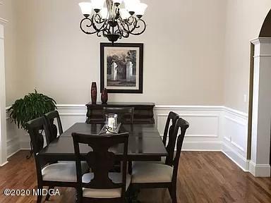 9743 Lower Thomaston Road Macon, GA 31220 - Photo 3 of 28 a view of a dining room with furniture window and wooden floor