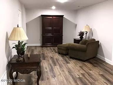 9743 Lower Thomaston Road Macon, GA 31220 - Photo 22 of 28 a living room with furniture and a lamp