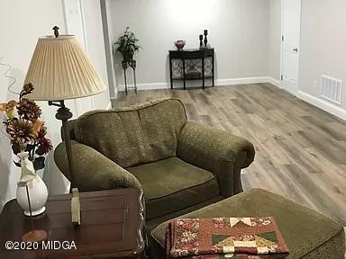 9743 Lower Thomaston Road Macon, GA 31220 - Photo 23 of 28 a living room with furniture and a lamp