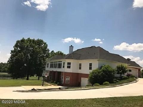 9743 Lower Thomaston Road Macon, GA 31220 - Photo 28 of 28 a view of a house with a yard